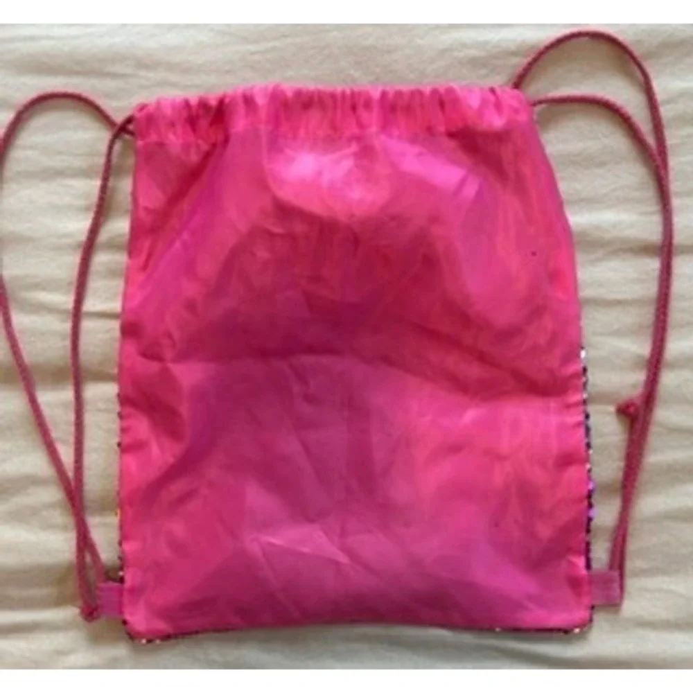 JoJo Siwa DREAM The Tour Rainbow Flip Sequin Drawstring Bag with White Bow Pink